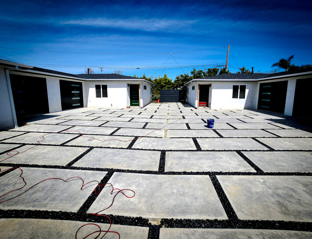 Concrete paver courtyard driveway with dark joints &mdash; Costa Mesa landscape project by Abode Landscaping